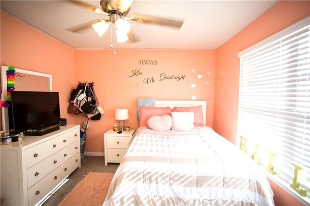 bedroom with ceiling fan and carpet flooring