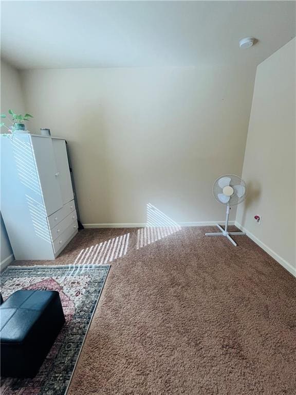 washroom with baseboards and carpet flooring