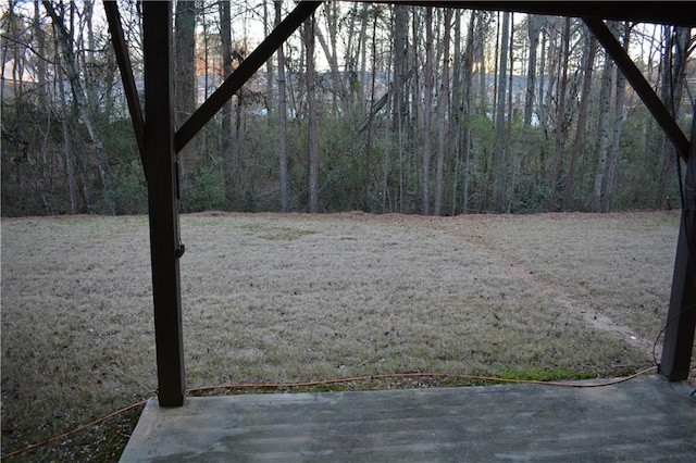 view of yard featuring a wooded view