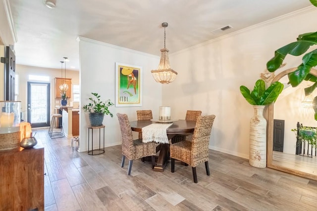 6426 Queens Court Trce Unit 7, Mableton, GA 30126 - dining space featuring a chandelier, wood finished floors, and crown molding