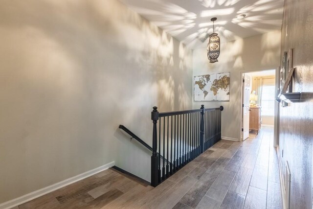 6426 Queens Court Trce Unit 7, Mableton, GA 30126 - stairway featuring wood finished floors and a chandelier