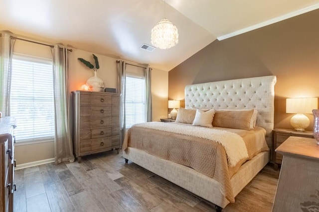 6426 Queens Court Trce Unit 7, Mableton, GA 30126 - bedroom with lofted ceiling, a chandelier, and wood finished floors