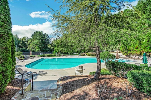 6426 Queens Court Trce Unit 7, Mableton, GA 30126 - community pool with a patio area and view of wooded area