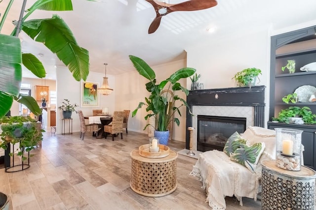 6426 Queens Court Trce Unit 7, Mableton, GA 30126 - living area with a ceiling fan, wood finished floors, a tiled fireplace, and built in features