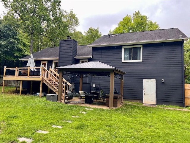 124 Dockside Downs Dr, Woodstock, GA 30189 - back of house featuring a gazebo, a wooden deck, a lawn, and a chimney
