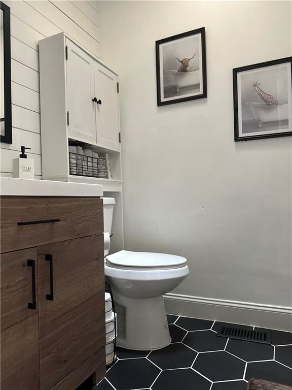 124 Dockside Downs Dr, Woodstock, GA 30189 - half bathroom featuring vanity and tile patterned flooring