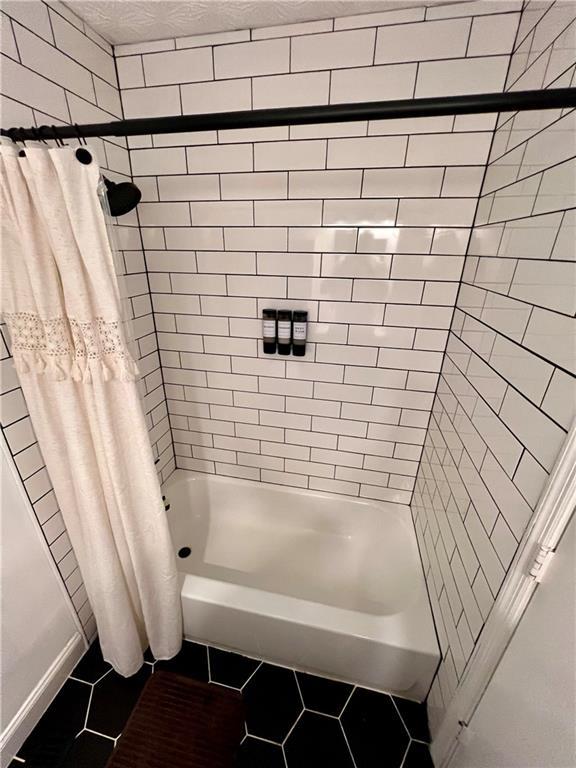 124 Dockside Downs Dr, Woodstock, GA 30189 - full bath featuring tile patterned floors and shower / tub combo with curtain