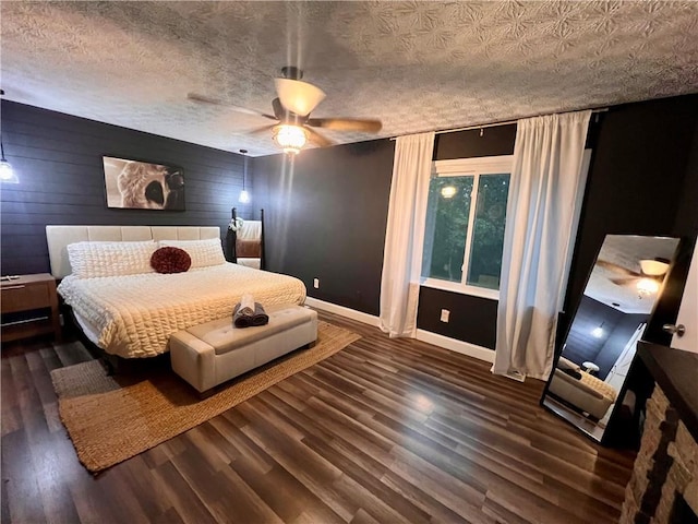 124 Dockside Downs Dr, Woodstock, GA 30189 - bedroom featuring wood finished floors, wooden walls, and a ceiling fan