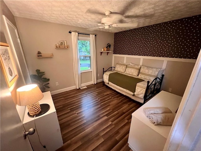 124 Dockside Downs Dr, Woodstock, GA 30189 - bedroom featuring dark wood-type flooring, a textured ceiling, and a ceiling fan