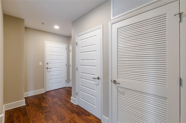 hall with dark wood-type flooring