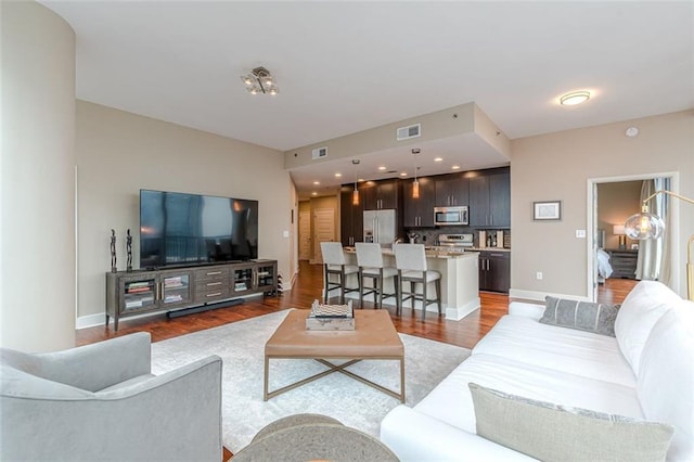 living room featuring dark hardwood / wood-style floors