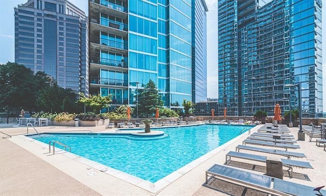 view of swimming pool with a patio