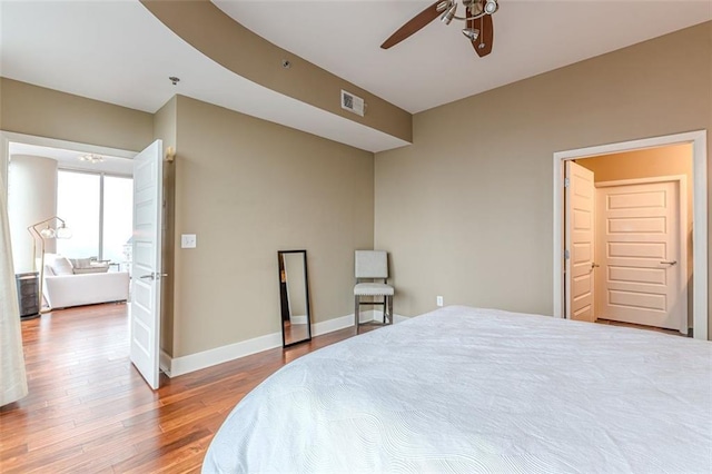 bedroom featuring ceiling fan and wood-type flooring