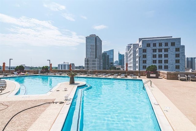 view of swimming pool with a patio area