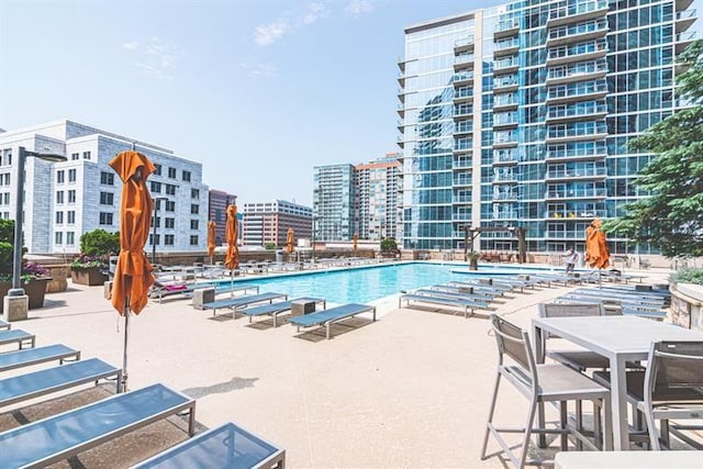 view of swimming pool featuring a patio