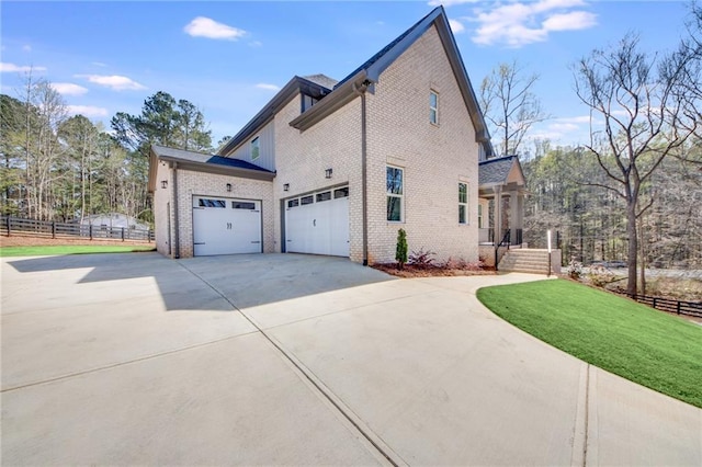 view of property exterior featuring a garage and a lawn