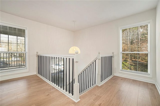 stairs featuring wood-type flooring