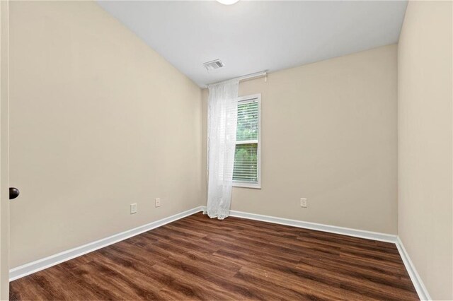 5440 Willow Oak Dr, Norcross, GA 30092 - spare room with baseboards and dark wood-type flooring