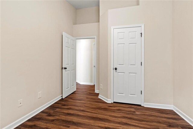 5440 Willow Oak Dr, Norcross, GA 30092 - unfurnished bedroom featuring dark wood finished floors and baseboards