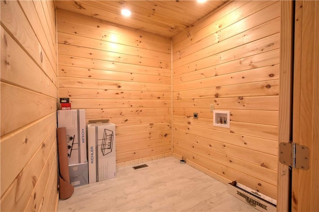 washroom featuring wood ceiling, washer hookup, wooden walls, and hardwood / wood-style floors