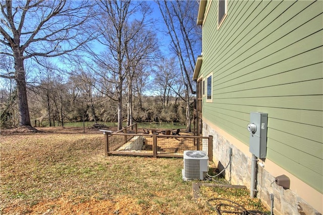 view of yard with central AC unit