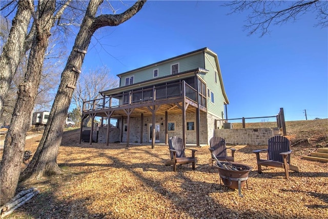 rear view of house with a deck