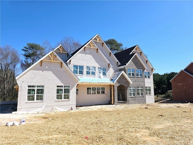 view of front facade featuring brick siding