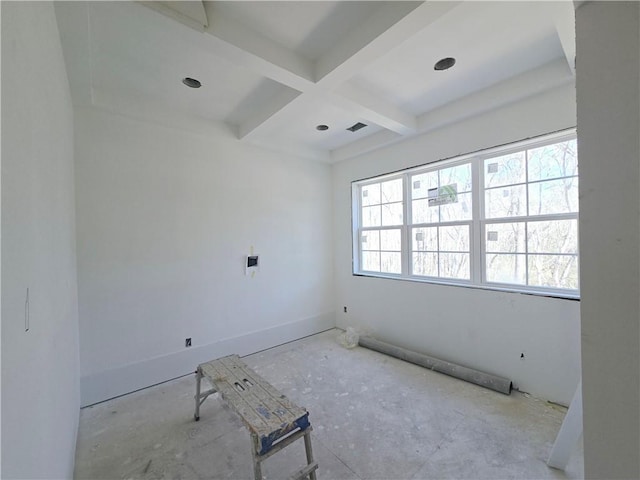 empty room featuring baseboards, coffered ceiling, and beamed ceiling