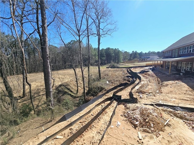 view of street with a wooded view