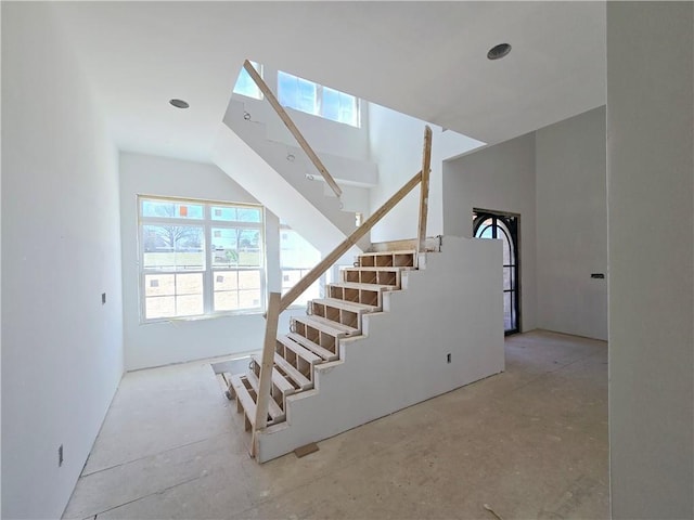 stairs with a skylight