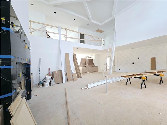 living room with a towering ceiling