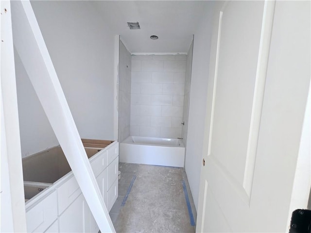 bathroom with unfinished concrete flooring and shower / bathing tub combination