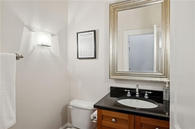 bathroom with toilet and vanity