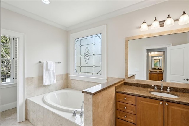 bathroom with vanity, a bath, and tile patterned flooring