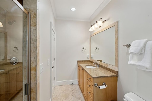 bathroom featuring toilet, ornamental molding, a shower stall, baseboards, and vanity