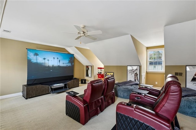 cinema featuring vaulted ceiling, visible vents, ceiling fan, and carpet floors