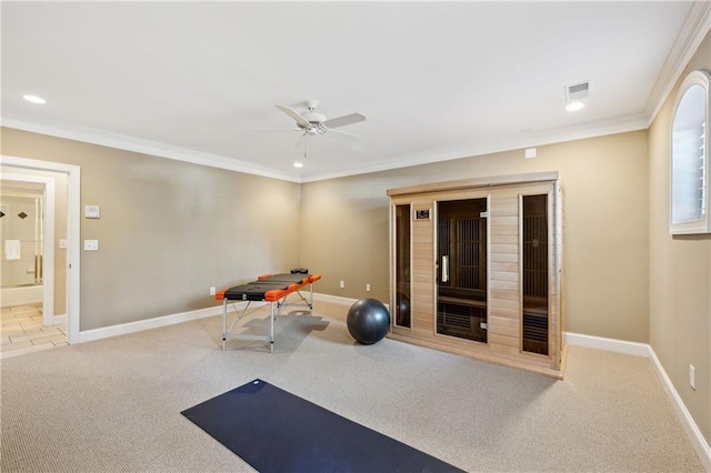 workout room with baseboards, a ceiling fan, crown molding, and carpet