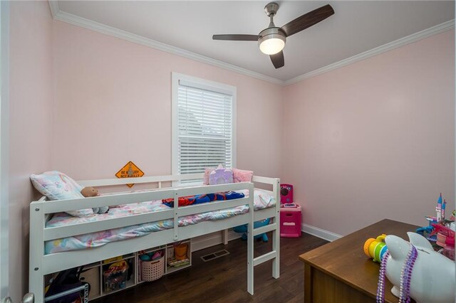 bedroom featuring ceiling fan, dark hardwood / wood-style flooring, and ornamental molding