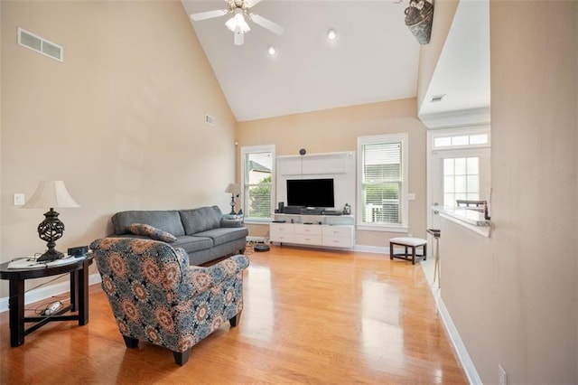 1979 Spivey Village Dr, Jonesboro, GA 30236 - living area with high vaulted ceiling, a ceiling fan, and light wood-type flooring