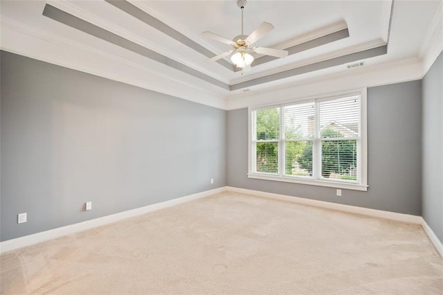 1979 Spivey Village Dr, Jonesboro, GA 30236 - spare room featuring a raised ceiling, carpet, ornamental molding, and ceiling fan