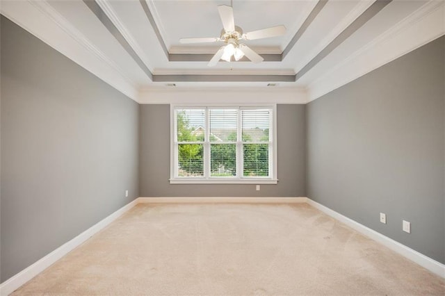 1979 Spivey Village Dr, Jonesboro, GA 30236 - spare room featuring light carpet, crown molding, a raised ceiling, and a ceiling fan