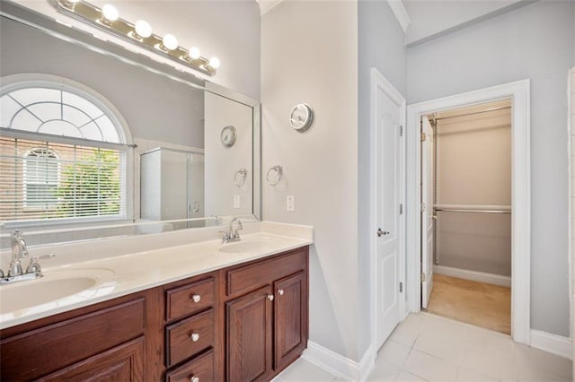1979 Spivey Village Dr, Jonesboro, GA 30236 - bathroom with a stall shower, double vanity, tile patterned floors, and crown molding