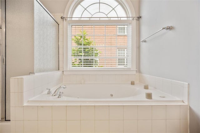 1979 Spivey Village Dr, Jonesboro, GA 30236 - bathroom featuring a jetted tub and an enclosed shower
