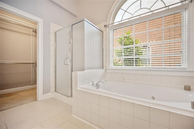 1979 Spivey Village Dr, Jonesboro, GA 30236 - full bath with a shower stall, a bath, and tile patterned floors
