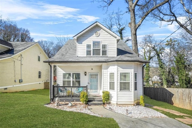 bungalow-style house featuring covered porch and a front yard