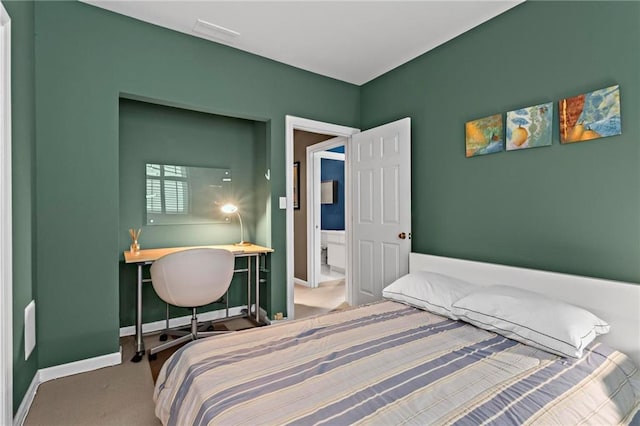 1421 Peachtree St NE Unit 212, Atlanta, GA 30309 - carpeted bedroom with baseboards