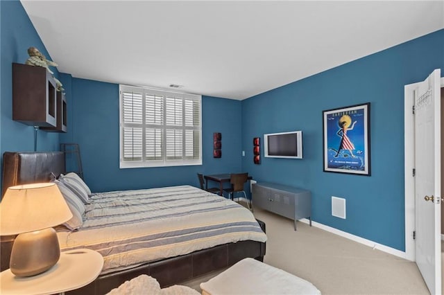 1421 Peachtree St NE Unit 212, Atlanta, GA 30309 - carpeted bedroom with baseboards