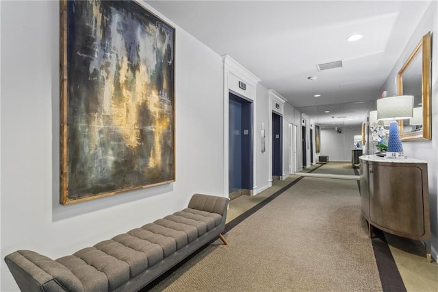 1421 Peachtree St NE Unit 212, Atlanta, GA 30309 - hall featuring elevator, recessed lighting, carpet floors, and baseboards