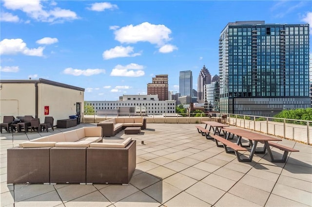 1421 Peachtree St NE Unit 212, Atlanta, GA 30309 - view of patio with outdoor lounge area and a view of skyline