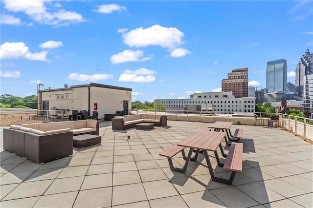 1421 Peachtree St NE Unit 212, Atlanta, GA 30309 - view of patio with an outdoor hangout area and a view of skyline